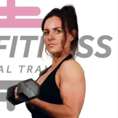 Cazza, Level 3 PT and class instructor, lifting a dumbbell